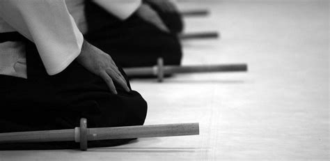 The simple act of seiza, sitting, with the traditional aikido bokken or ...