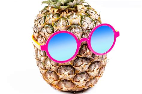 Pineapple in round sunglasses on a yellow background - Creative Commons ...