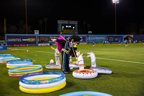 Las Vegas Lights FC mascot Cash interacts with blowup llamas during the ...