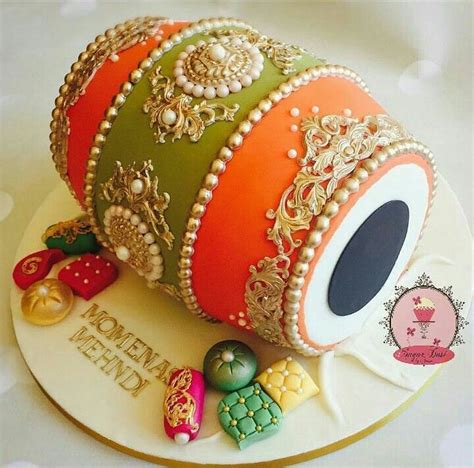 This colorfully Indian dholki inspired cake by @sugardustbyamina is the perfect match to your ...