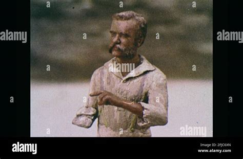 1960s: Statue of man with one arm. Head of statue. Man with one-arm stands by Stock Video ...