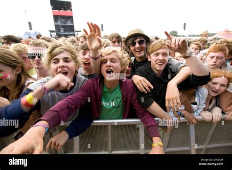 Crowd in front row screaming at a music concert Stock Photo - Alamy