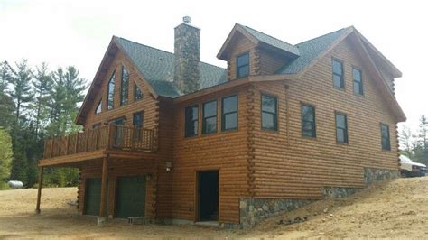 Back view of a custom Ward Cedar Log Home in Rumford, ME. View our ...