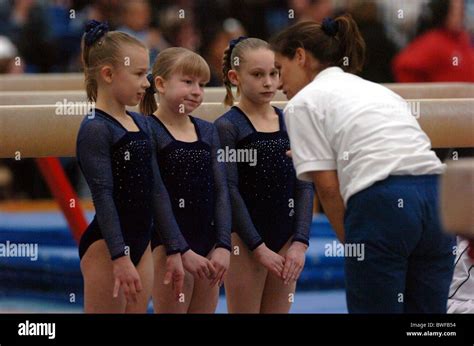 A gymnastics coach Stock Photo - Alamy