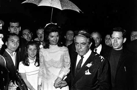 Jackie O holds onto her daughter, Caroline Kennedy, as the newlywed ...