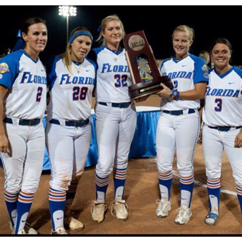 the florida softball team poses with their trophy