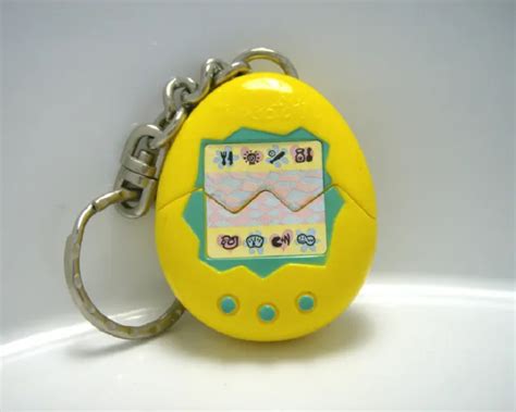 VINTAGE 1990S MCDONALDS Tamagotchi in Yellow Toy Keychain in nice shape $0.99 - PicClick