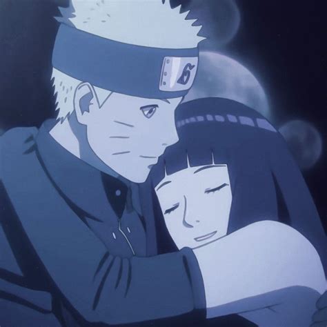 two anime characters hugging each other in the dark