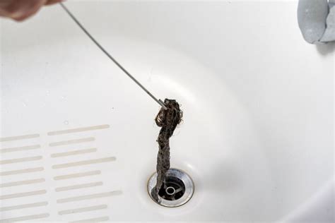 Drain Clogged With Hair: 5 Simple Tips To Dissolve it | Water Heater Hub