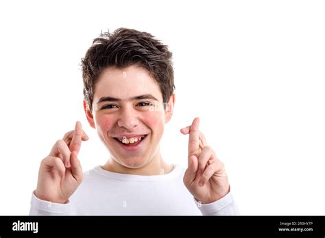 Crossed fingers as lucky gesture by Latin young boy with acne Stock ...