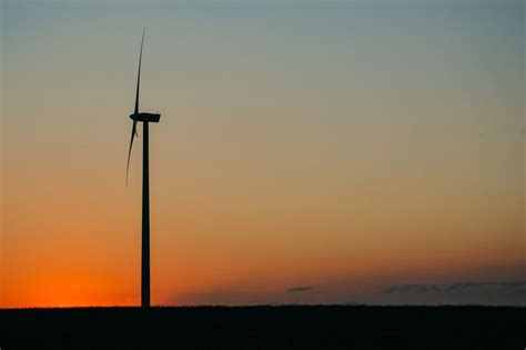 a wind turbine at sunset from Pikwizard