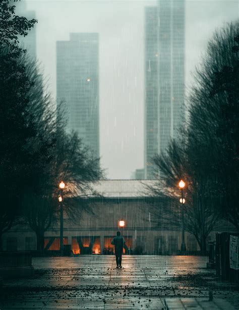 Lonely Man Walking In Rain