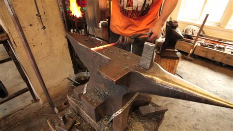 Artist blacksmith Tobbe Malm forging a corkscrew - YouTube