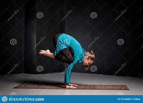 Woman Practicing Yoga, Doing Crane Exercise, Bakasana Pose, Working Out. Stock Image - Image of ...