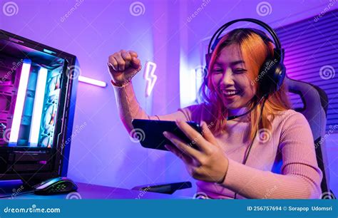 Happy Gamer Playing Video Game Online with Smartphone she Raises Hands To Wins Stock Photo ...