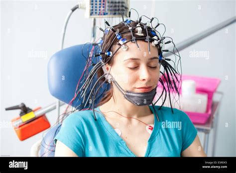 Woman undergoing an electroencephalogram (EEG), Limoges hospital, France Stock Photo - Alamy