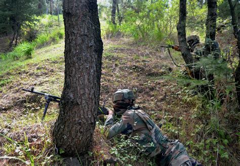 Indian Army soldiers conduct a training exercise in the Kashmir region ...