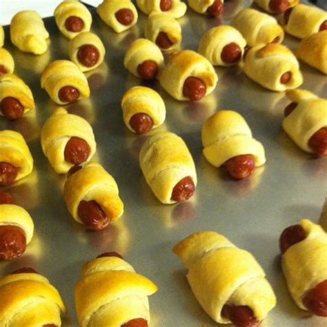 Homemade Pigs in a Blanket! Wrap crescent rolls around cocktail weenies. Follow directions on ...