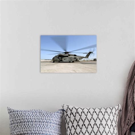 An MH53E Sea Dragon helicopter sits ready on the flight line Wall Art, Canvas Prints, Framed ...