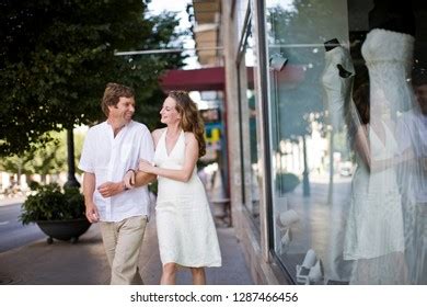 Couple Linking Arms Outside Bridal Store Stock Photo 1287466456 | Shutterstock