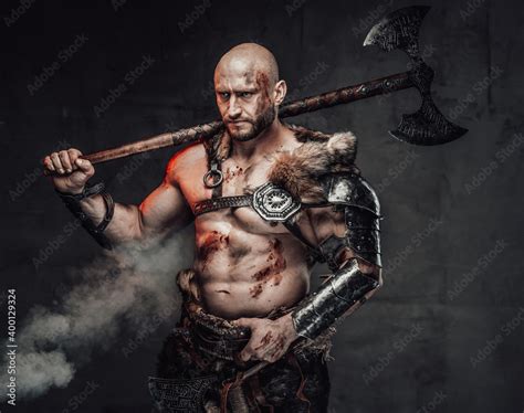 Portrait of a furious viking warrior with grimy and bloody skin in ...