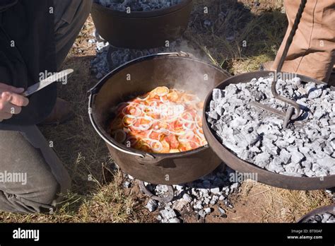 Cowboy cooking in a cast-iron kettle - Lincoln County Cowboy Symposium and Chuck Wagon Cook-Off ...