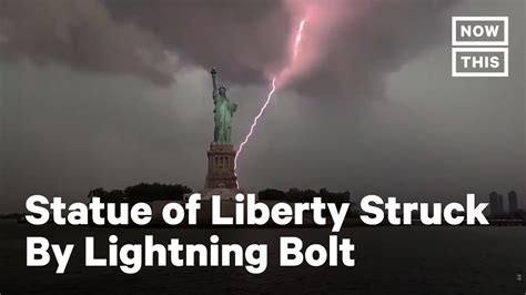 Lightning Strikes Behind the Statue of Liberty | NowThis - YouTube