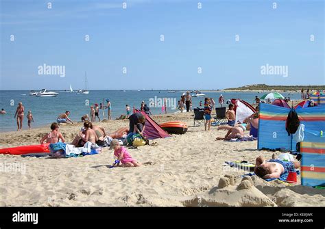 Families on Studland bay beach, Dorset, England Stock Photo - Alamy