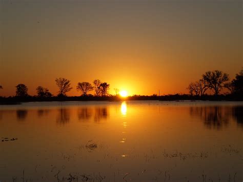 Sunset in the Okavango Delta, Botswana Okavango Delta, Celestial ...