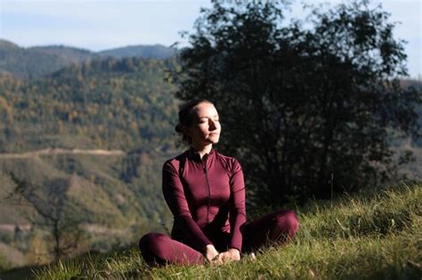 Premium Photo | Woman practices yoga outdoor in mountain landscape