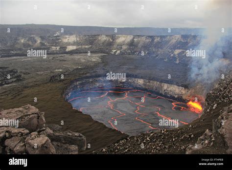 The lava lake in Halemaumau Crater filled with molten magma in a flow field at the Kilauea ...