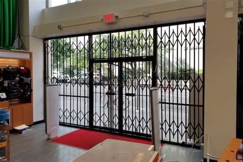 Storefront folding Gates - Driveway Gates Houston