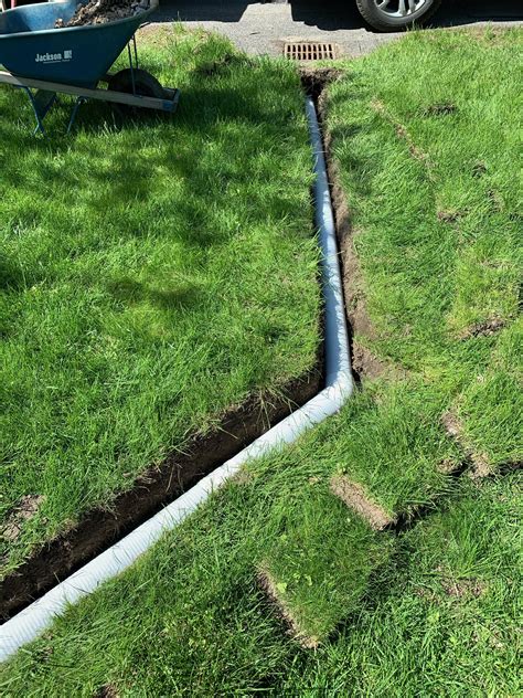 Sump pump drainage system installation. Sump pump discharge pipe on ...