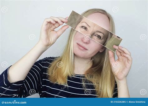 The Girl Holds a Photograph of Her Old Mother To Her Face. Aging, Genetics, Family Tree and Loss ...