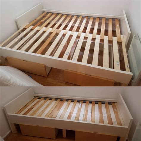 the bed frame is made out of wooden planks