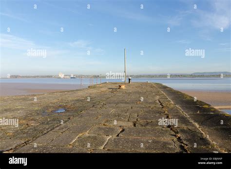 The harbour wall at Lydney Harbour on the West bank of the River Severn in Gloucestershire Stock ...