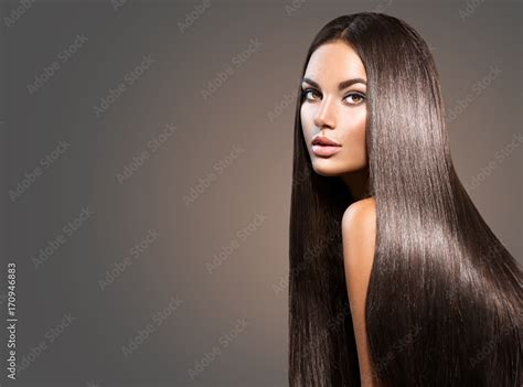 Beautiful long hair. Beauty woman with straight black hair on dark ...