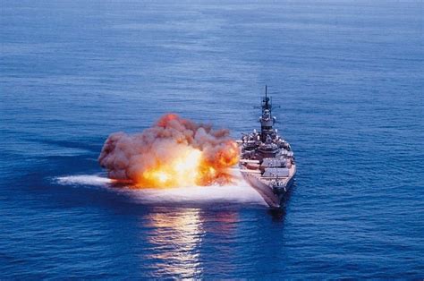 Battleship firing full broadside.