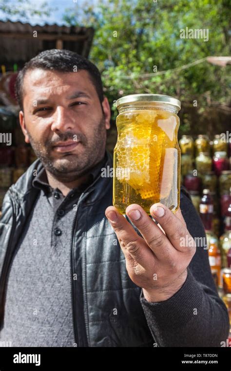 Azerbaijan, Vandam, male vendor with honeycomb Stock Photo - Alamy