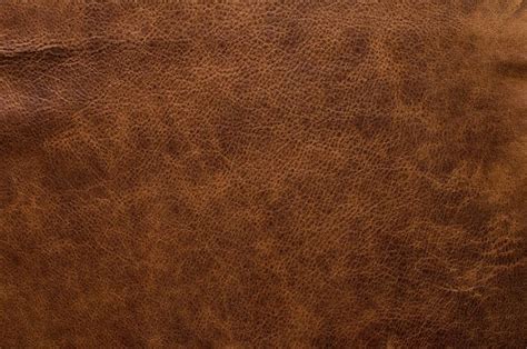 a brown leather texture background or wallpaper that looks like it has ...