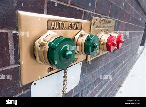 building wall fire hydrant stand pipes Stock Photo - Alamy