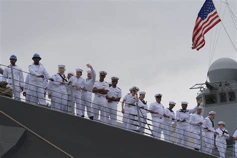 Sailors aboard USS Gravely wave to family and friends as t… | Flickr