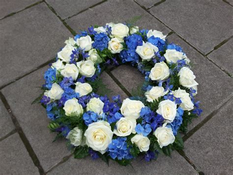 blue flower arrangement for funeral - Wes Wilder