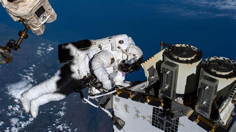 NASA and JAXA Astronauts Begin Spacewalk To Prep for Space Station Power Upgrades