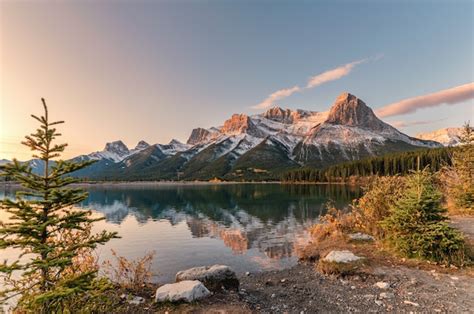 Premium Photo | Sunrise on mount rundle with colorful sky reflection on rundle forebay reservoir ...