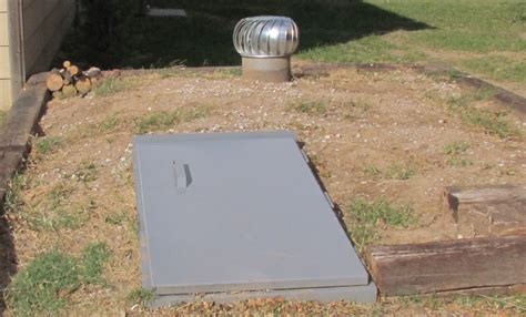 Below Ground Tornado Shelters - Garage Underground Storm Shelters