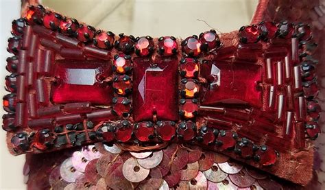 Thousands of tiny red sequins bask in individual attention as part of the conservation of ...