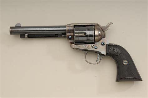 Colt SAA revolver, .44-40 cal., 5-1/2” barrel, blue and case hardened finish, checkered black hard