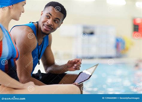 Aqua Fitness Coach in Pool stock photo. Image of aqua - 139660080