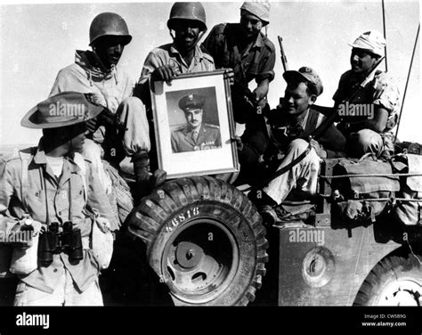 Suez Crisis, Israeli soldiers bringing back a portrait of Nasser as a ...